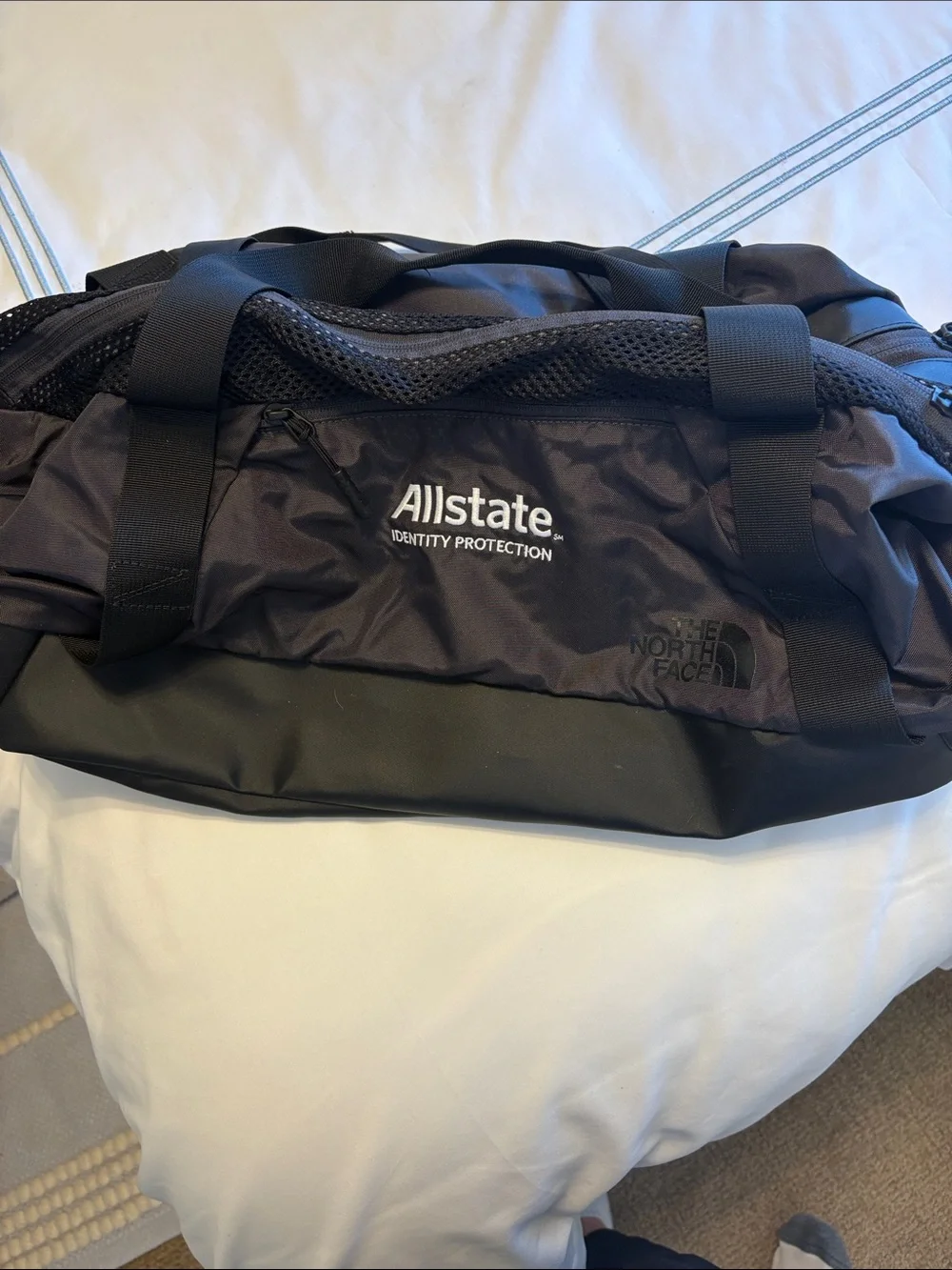 The North Face Black Duffel with Allstate Logo